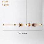 Lámpara colgante de cristal minimalista con detalles de latón