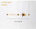 Lámpara colgante de cristal minimalista con detalles de latón