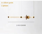 Lámpara colgante de cristal minimalista con detalles de latón