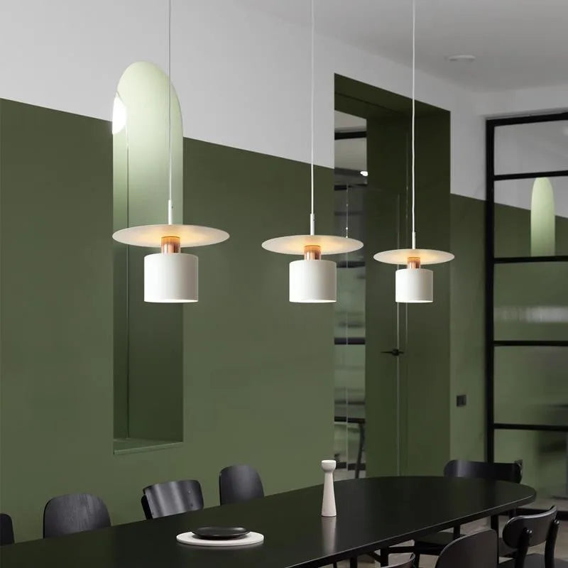 Modern Black Disc and Cylinder Pendant Light with Copper Glow for Bedside