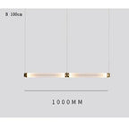 Lámpara colgante de cristal minimalista con detalles de latón