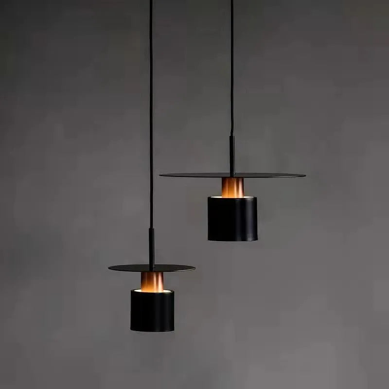 Modern Black Disc and Cylinder Pendant Light with Copper Glow for Bedside