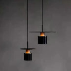 Modern Black Disc and Cylinder Pendant Light with Copper Glow for Bedside